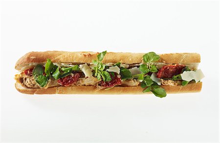 simsearch:659-07027045,k - A chicken and dried tomato sandwich on a baguette Stock Photo - Premium Royalty-Free, Code: 659-06154789