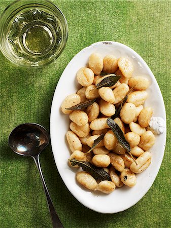 sage dish - Ricotta gnocci with sage (seen from above) Stock Photo - Premium Royalty-Free, Code: 659-06154818