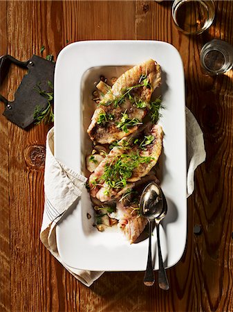 fish dish - Fried rockfish with Jerusalem artichokes (seen from above) Stock Photo - Premium Royalty-Free, Code: 659-06154813