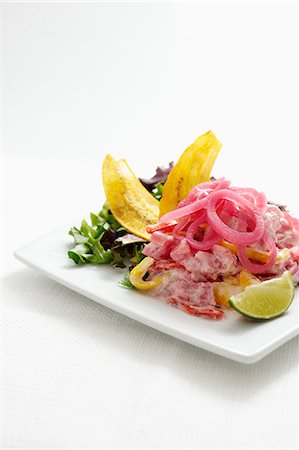 Ceviche de Atun; Ceviche with Tuna, Coconut Milk and Pickled Onions Fotografie stock - Premium Royalty-Free, Codice: 659-06154975