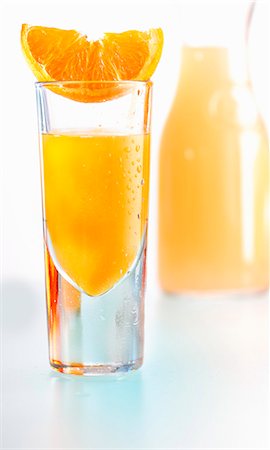 simsearch:659-01851750,k - An orange juice shooter Foto de stock - Sin royalties Premium, Código: 659-06155072