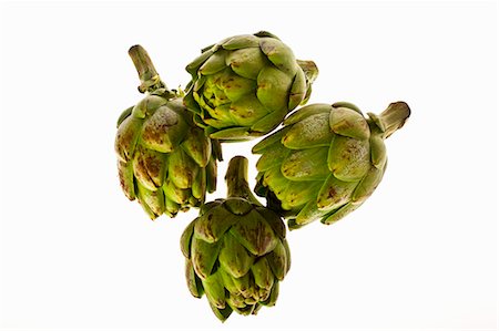 simsearch:659-06155506,k - Four Whole Artichokes on White Background Foto de stock - Sin royalties Premium, Código: 659-06155506