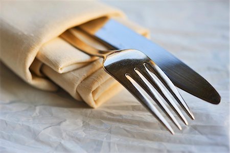 simsearch:659-01846629,k - Fabric serviette with a knife and fork Stock Photo - Premium Royalty-Free, Code: 659-06155523