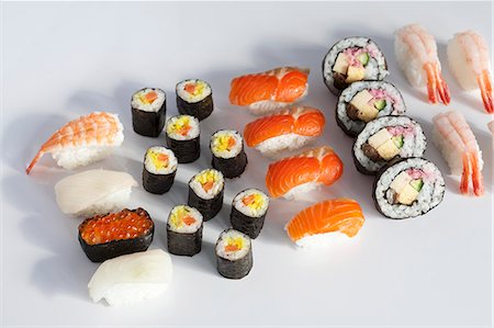 Various type of sushi on a white surface Stock Photo - Premium Royalty-Free, Code: 659-06155567