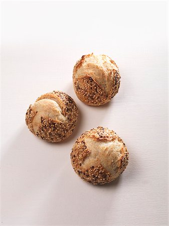 simsearch:659-08905552,k - Three sesame seed rolls Stock Photo - Premium Royalty-Free, Code: 659-06155742