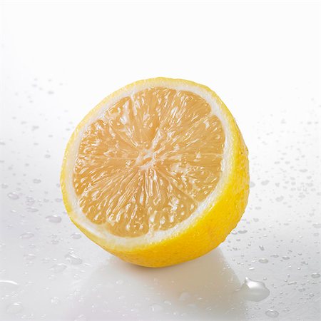 fresh lemon - A freshly washed half lemon Stock Photo - Premium Royalty-Free, Code: 659-06155779