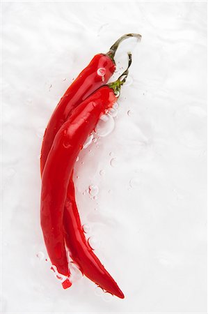 Two red chilli peppers in water Stock Photo - Premium Royalty-Free, Code: 659-06155810