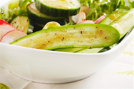 Fresh Salad with Cucumbers and Radishes; Balsamic Dressing Stock Photo - Premium Royalty-Free, Code: 659-06155875