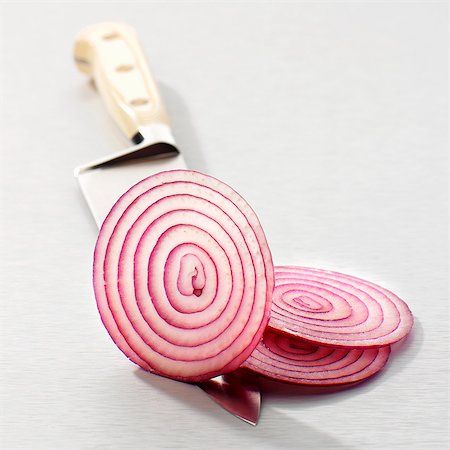 fresh onion - Slices of red onion on a knife Stock Photo - Premium Royalty-Free, Code: 659-06155920