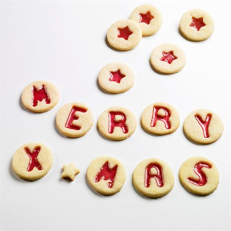 Jam biscuits spelling out MERRY XMAS Stock Photo - Premium Royalty-Free, Code: 659-06155934