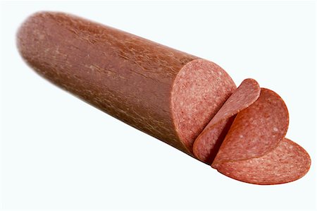 salami - Partially Sliced Salami; White Background Stock Photo - Premium Royalty-Free, Code: 659-06156018