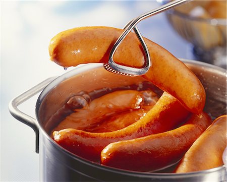 raised - Sausages being removed from a pot Stock Photo - Premium Royalty-Free, Code: 659-06151070