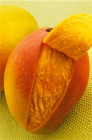 Mango, partly peeled Stock Photo - Premium Royalty-Free, Code: 659-06151080