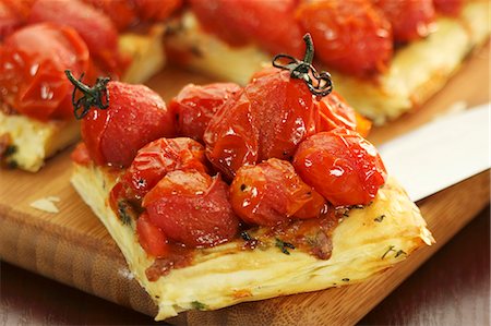 puff pastry - Tomato tart, a piece cut Stock Photo - Premium Royalty-Free, Code: 659-06151107