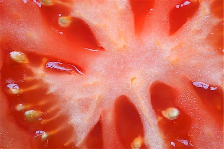 Une tomate en tranches (détail) Photographie de stock - Premium Libres de Droits, Code: 659-06151707