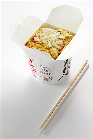 Nasi goreng in a take away box Foto de stock - Sin royalties Premium, Código: 659-06152042