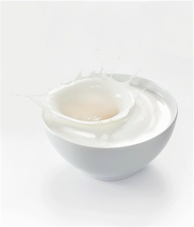 A splash of yogurt in a white bowl Stock Photo - Premium Royalty-Free, Code: 659-06152077