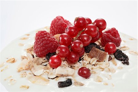 fruit muesli yoghurt - Berry muesli on a dollop of yogurt (close-up) Stock Photo - Premium Royalty-Free, Code: 659-06152073