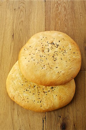 Oriental unleavened bread on a wooden table Stock Photo - Premium Royalty-Free, Code: 659-06152286