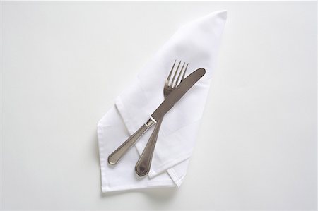 simsearch:659-08905188,k - Cutlery on a white napkin, seen from above Stock Photo - Premium Royalty-Free, Code: 659-06152306