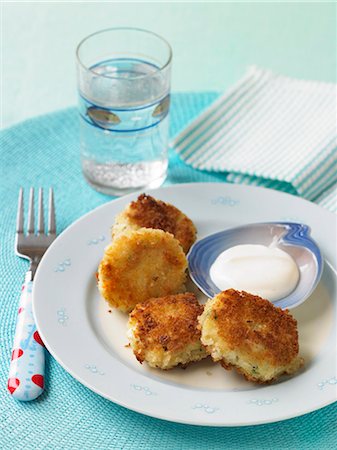 fish rissole - Mini Fish Cakes with Dipping Sauce; Fork and Glass of Water Stock Photo - Premium Royalty-Free, Code: 659-06152372