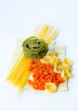 raw pasta photography - Spaghetti, green tagliatelle, pipe rigate, orecchiette and lasagne Stock Photo - Premium Royalty-Free, Code: 659-06152391