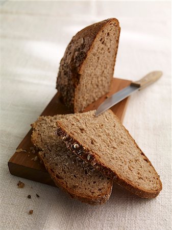 sour dough bread - Spiced bread on a chopping board Stock Photo - Premium Royalty-Free, Code: 659-06152624