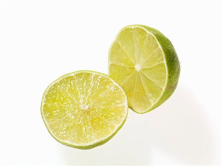 Two lime halves Fotografie stock - Premium Royalty-Free, Codice: 659-06152652