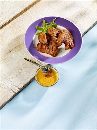 Grilled chicken wings with a dip Stock Photo - Premium Royalty-Free, Code: 659-06152677