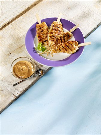 Grilled chicken satay kebabs with a peanut dip Stock Photo - Premium Royalty-Free, Code: 659-06152673