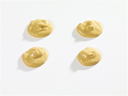 Four dollops if mustard Foto de stock - Sin royalties Premium, Código: 659-06152684