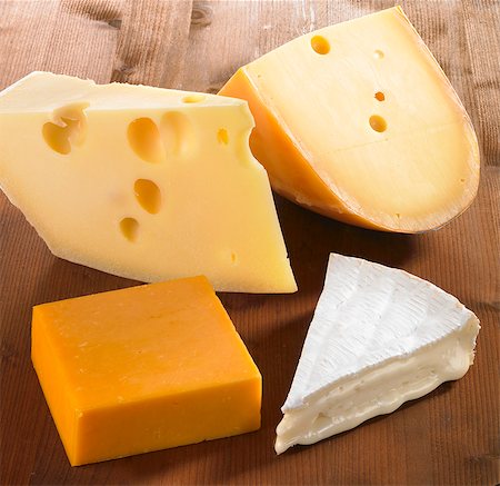 simsearch:659-06902579,k - Four pieces of cheese (Emmentaler, Gouda, Cheddar and Brie) Stock Photo - Premium Royalty-Free, Code: 659-06152690