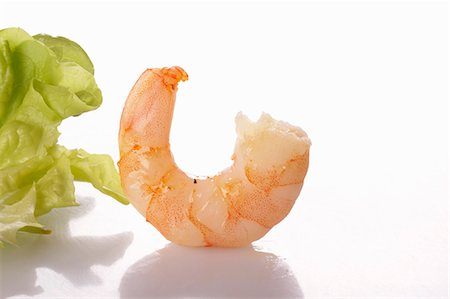 A cooked prawn and a lettuce leaf Stock Photo - Premium Royalty-Free, Code: 659-06152691