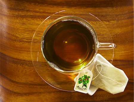 simsearch:659-08419484,k - Mulberry tea in a glass cup, seen from above with a tea bag on the saucer Stock Photo - Premium Royalty-Free, Code: 659-06152787