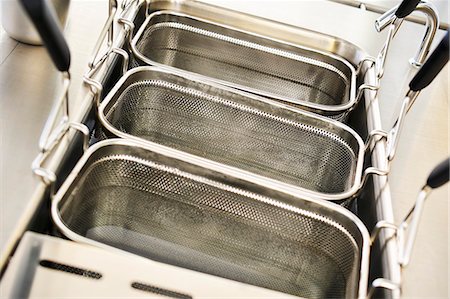 Deep fryers being cleaned with water Stock Photo - Premium Royalty-Free, Code: 659-06152835