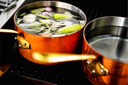 pot food - Copper pots of soup and water on a hob Stock Photo - Premium Royalty-Free, Code: 659-06152831