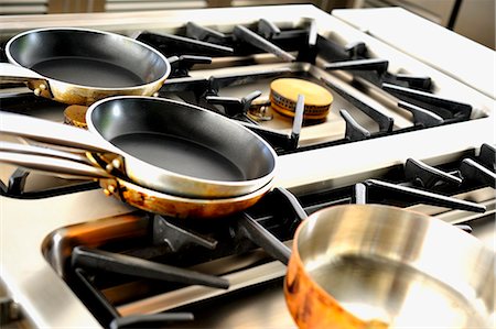 Various pots on a gas cooker Stock Photo - Premium Royalty-Free, Code: 659-06152832