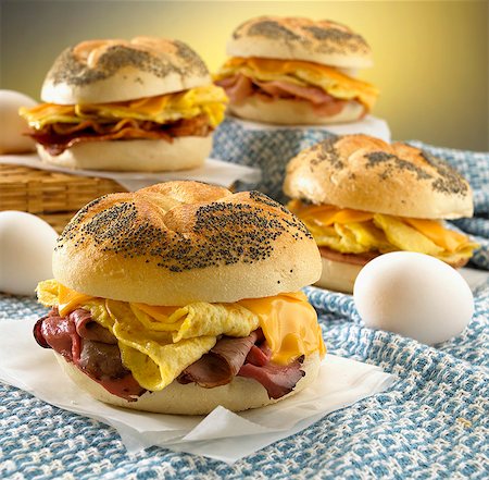 simsearch:659-06373352,k - Breakfast Sandwiches on Poppy Seed Rolls Stock Photo - Premium Royalty-Free, Code: 659-06152846