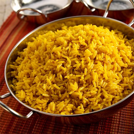 A Bowl of Spanish Yellow Rice (Arroz Amarillo) Stock Photo - Premium Royalty-Free, Code: 659-06152971