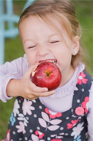 eaten - A girl biting into an apple Stock Photo - Premium Royalty-Free, Code: 659-06153027