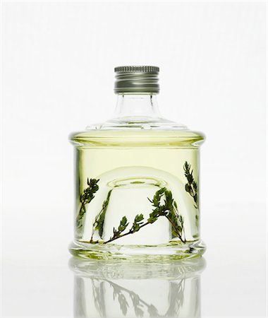 A bottle of thyme vinegar Stock Photo - Premium Royalty-Free, Code: 659-06153135