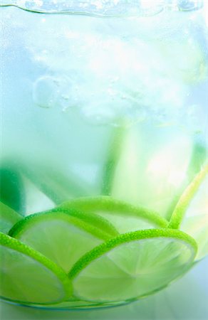 A jug of water with limes (close-up) Stock Photo - Premium Royalty-Free, Code: 659-06153209