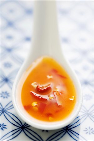 food sauces - Chilli sauce on a spoon Stock Photo - Premium Royalty-Free, Code: 659-06153244