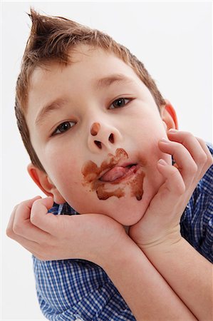 stain on shirt - A little boy with chocolate around his mouth Stock Photo - Premium Royalty-Free, Code: 659-06153339