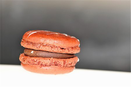 set cream - Orange macaroon with chocolate cream filling Stock Photo - Premium Royalty-Free, Code: 659-06153786