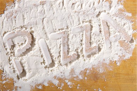 The word 'pizza' written in flour Foto de stock - Sin royalties Premium, Código: 659-06153800