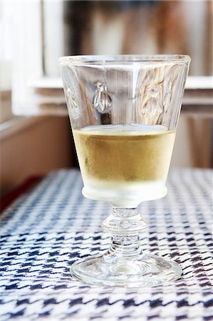 Cold Glass of White Wine on a Table in Paris, France Stock Photo - Premium Royalty-Free, Code: 659-06153830