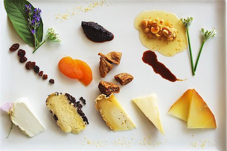 A cheese plate of dried fruit in a restaurant (Piemont, Italy) Stock Photo - Premium Royalty-Free, Code: 659-06153958