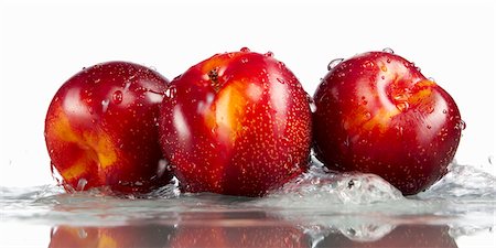 fruit splashing in water - Three plums in water Stock Photo - Premium Royalty-Free, Code: 659-06184045