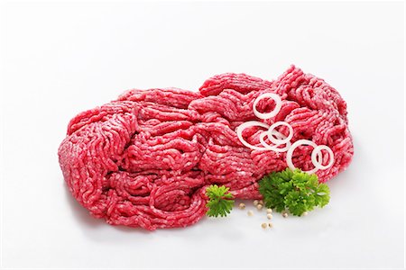 Freshly minced meat, onion rings and parsley Foto de stock - Sin royalties Premium, Código: 659-06184099